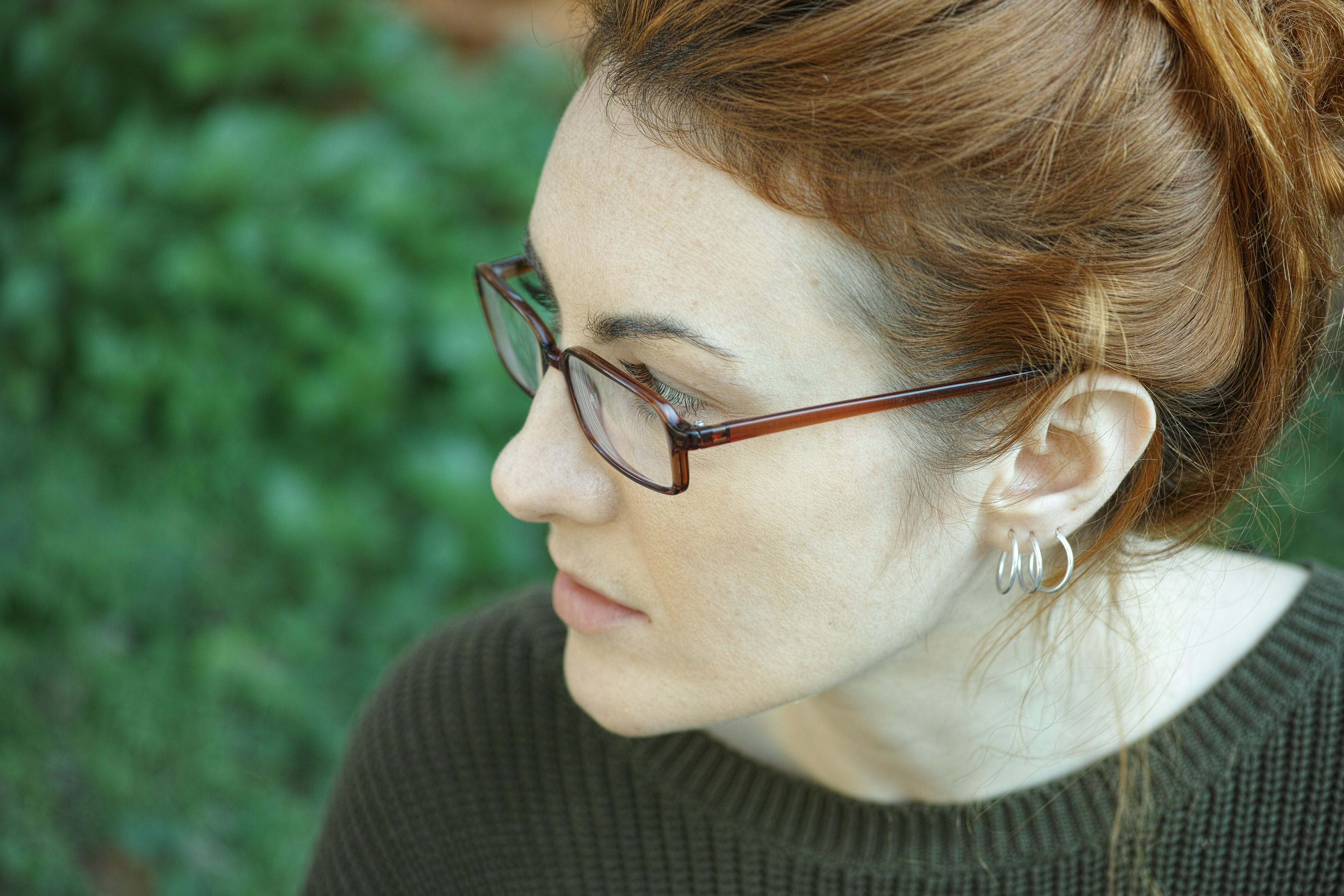 woman in black turtleneck shirt wearing eyeglasses